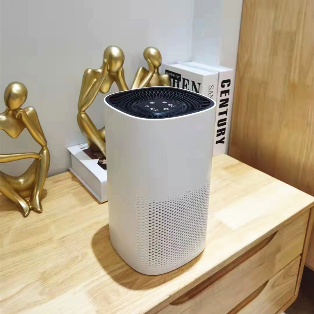 Quiet mini air purifier operating at night on a bedroom nightstand.