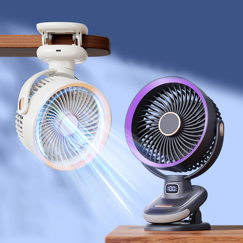 Ultra quiet personal desk fan cooling a laptop and paperwork on an office desk.